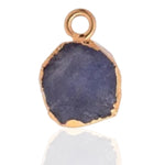 Load image into Gallery viewer, Raw Tanzanite Pendant - Natural December Birthstone Electroplated with 18ct Gold, reflection of stone seen with neutral white background
