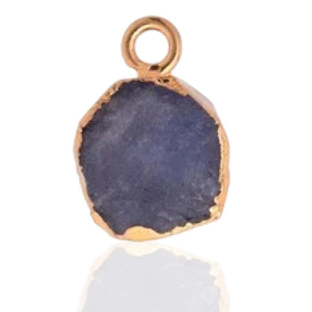 Raw Tanzanite Pendant - Natural December Birthstone Electroplated with 18ct Gold, reflection of stone seen with neutral white background